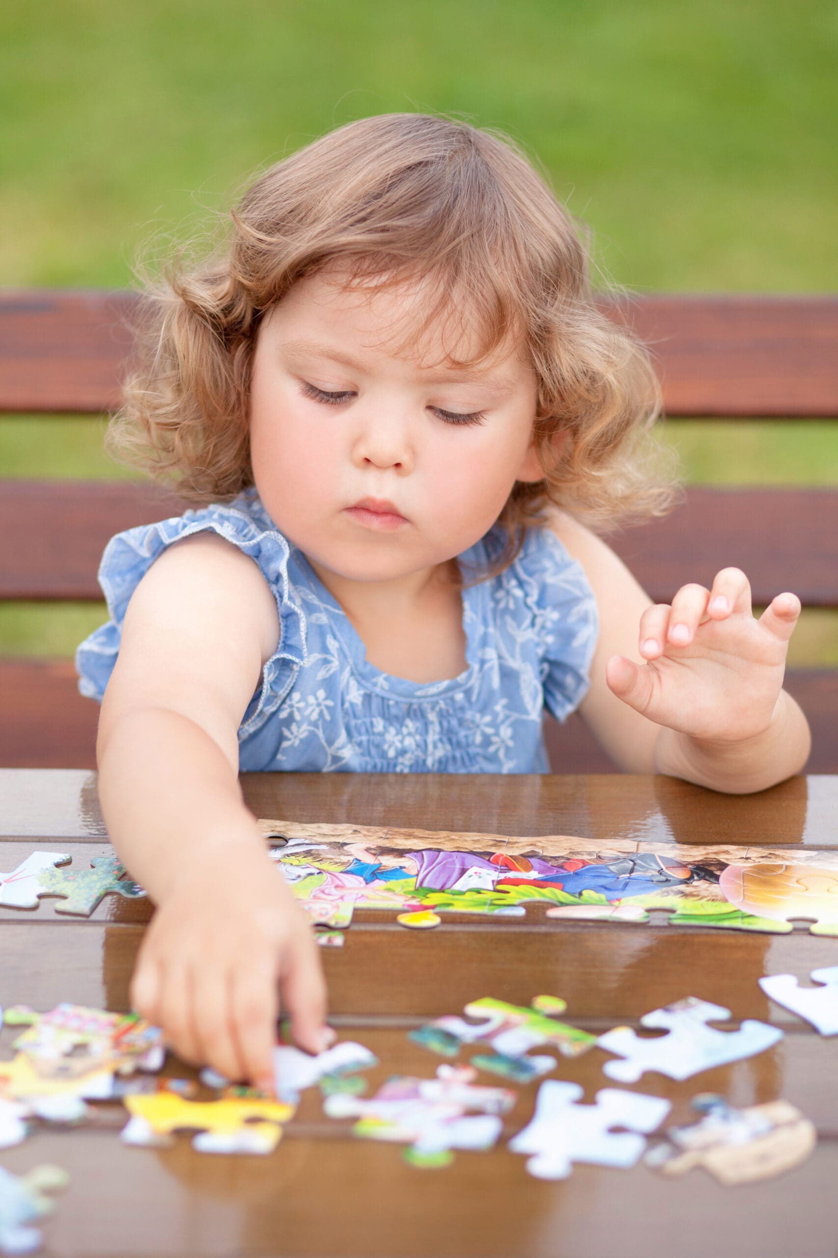 Toddler Girl Solving Puzzle On A Table - Toddler Toys Toddler Girl Solving Puzzle On A Table