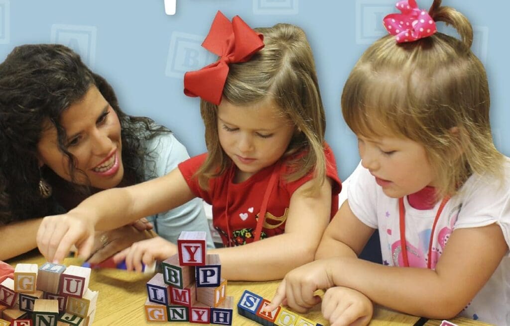 Skoolzy Toddler Letter Alphabet Blocks and a teacher whom teaching the kids