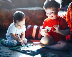 kid playing with interactive books