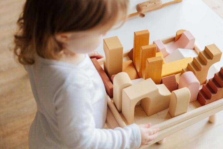 child playing with wooden block toys - Toddler Toys child playing with wooden block toys