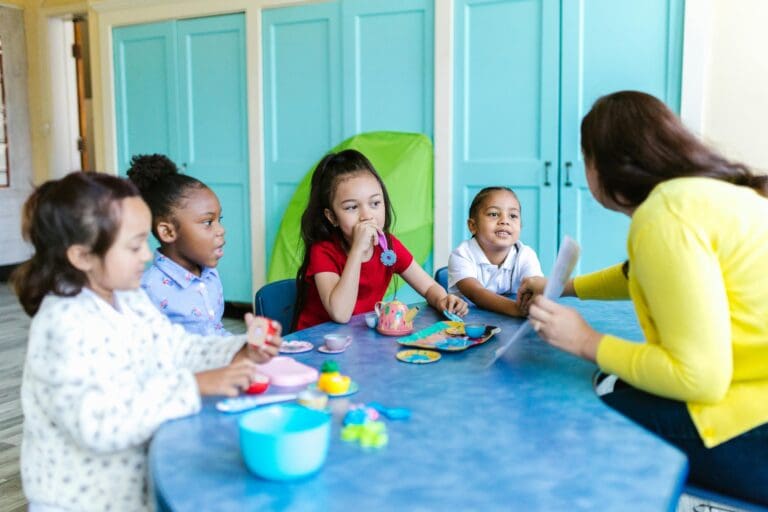 children and a teacher in the class room - Toddler Toys children and a teacher in the class room